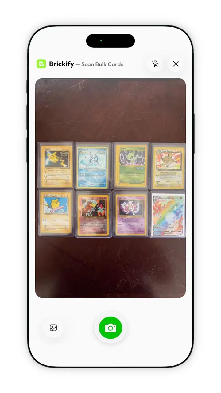 Brickify bulk scanning camera showing eight sleeved Pokémon cards laid out in two rows.